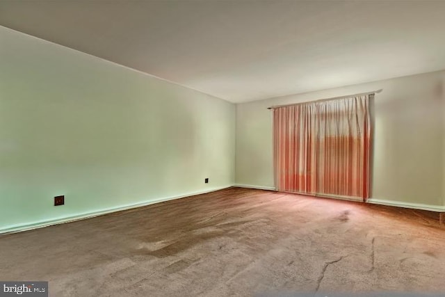 unfurnished room featuring carpet floors