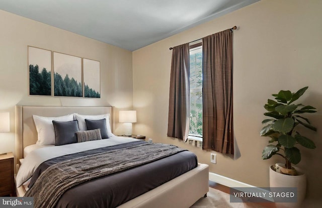 bedroom with light hardwood / wood-style flooring