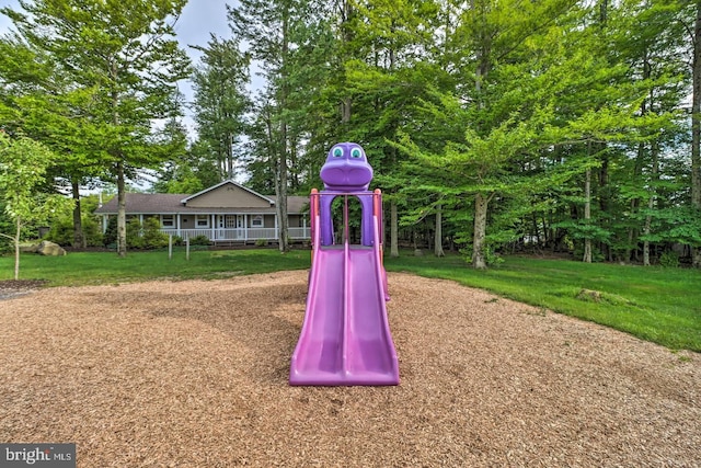 view of jungle gym featuring a yard