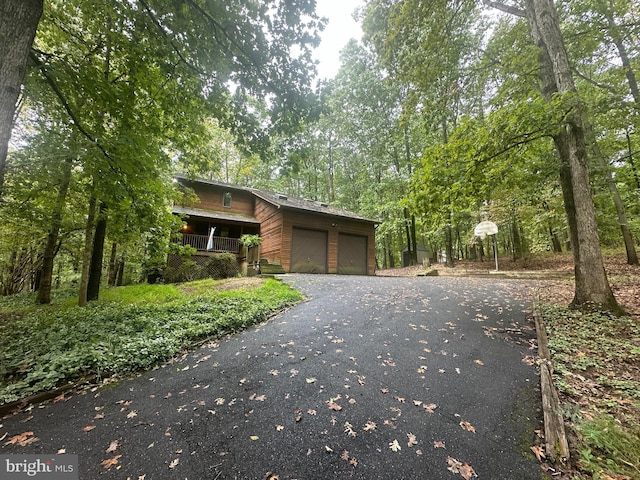 view of front of property with a porch and an attached garage