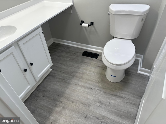 206 Mustang Ct, Gambrills, MD 21054 - bathroom featuring baseboards, toilet, visible vents, vanity, and wood finished floors