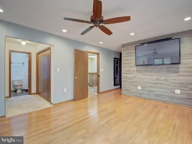 unfurnished living room featuring recessed lighting, baseboards, and wood finished floors