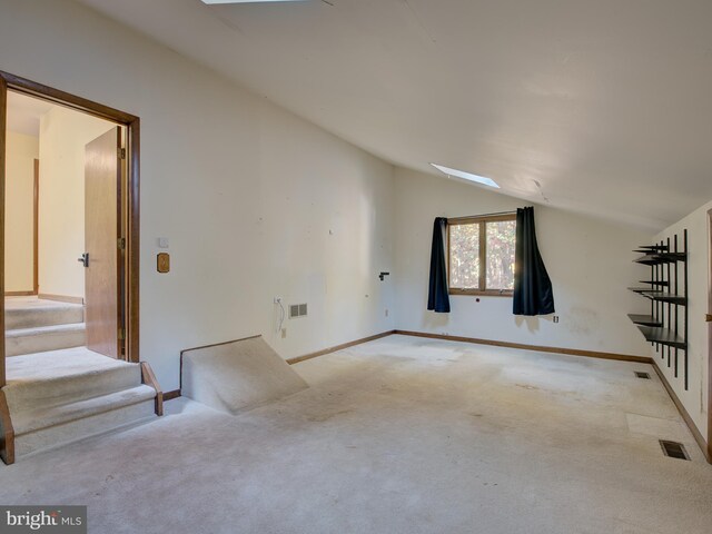 bonus room featuring stairway, visible vents, carpet, and vaulted ceiling