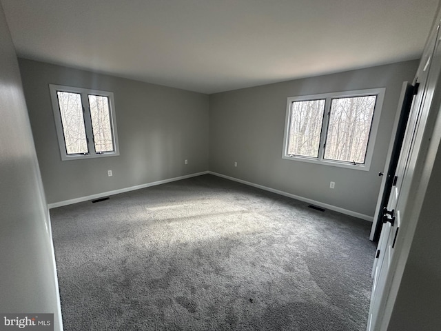 206 Mustang Ct, Gambrills, MD 21054 - empty room with dark colored carpet, baseboards, and visible vents