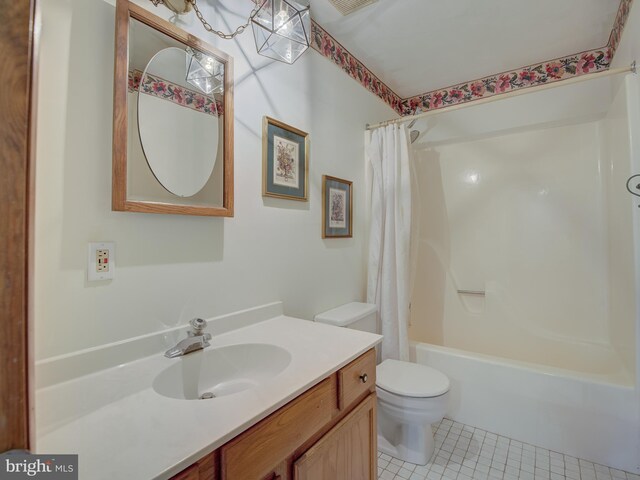 bathroom featuring tile patterned floors, toilet, shower / bath combo, and vanity