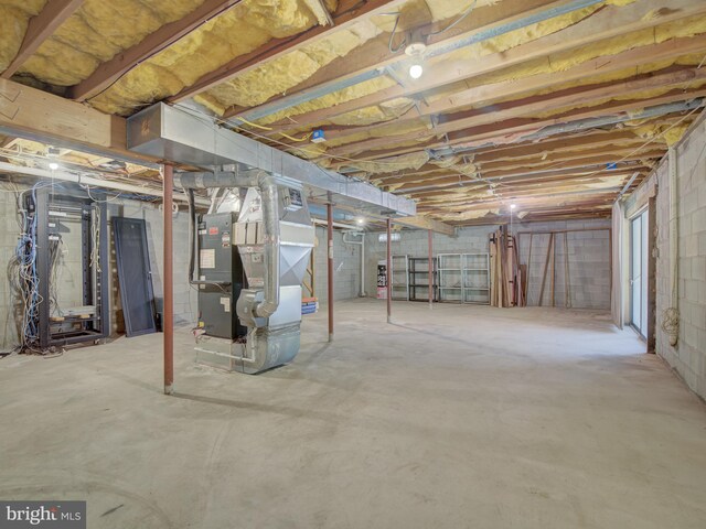 unfinished basement with heating unit