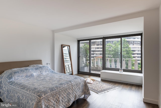 bedroom with wood-type flooring