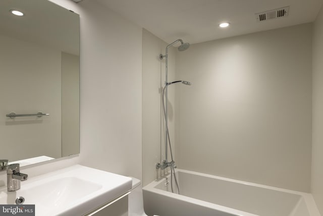 bathroom with vanity and shower / bathing tub combination