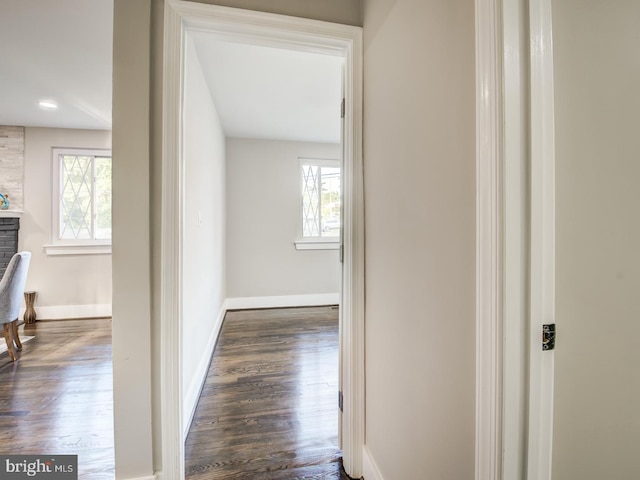 corridor featuring dark hardwood / wood-style flooring