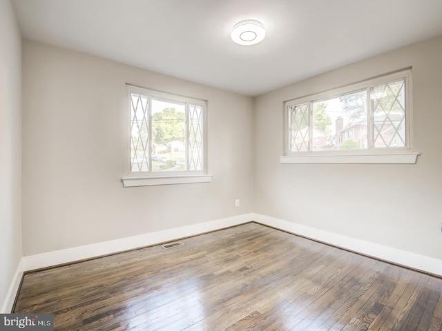 empty room featuring wood-type flooring