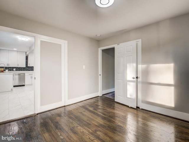 unfurnished bedroom featuring wood-type flooring