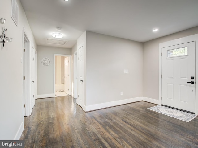 foyer with dark wood-type flooring