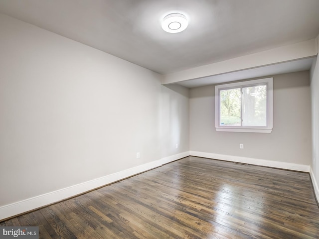 empty room featuring dark hardwood / wood-style floors