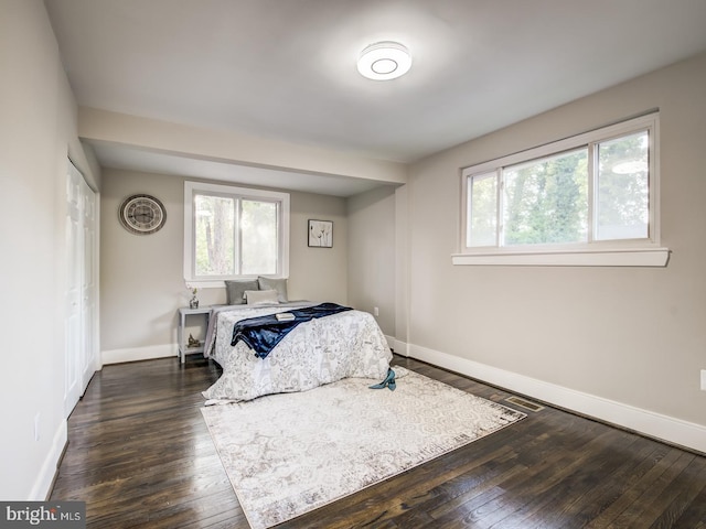 bedroom featuring dark hardwood / wood-style floors