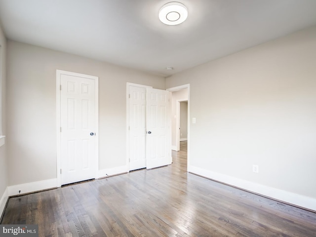 unfurnished bedroom featuring hardwood / wood-style floors