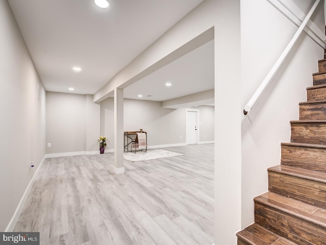 basement featuring light hardwood / wood-style flooring