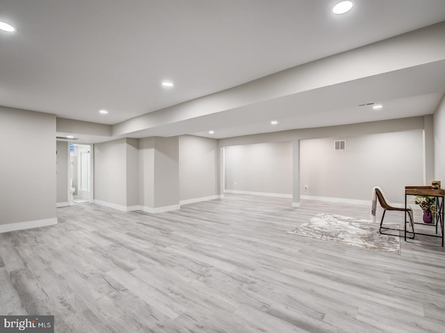 basement featuring light hardwood / wood-style flooring