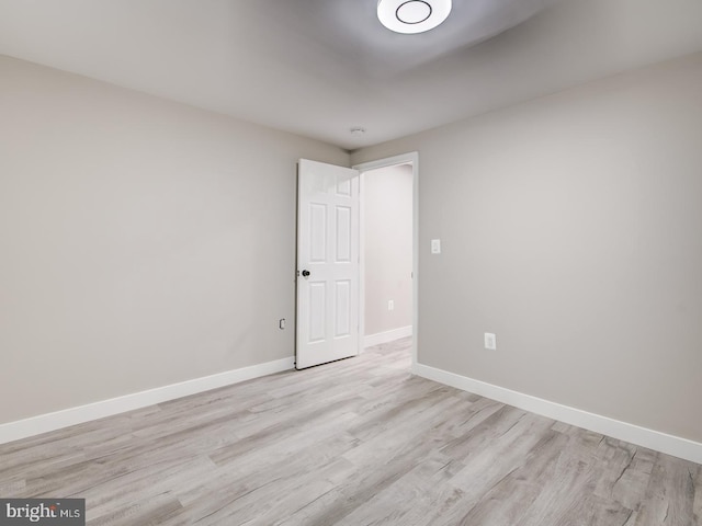 empty room with light hardwood / wood-style floors