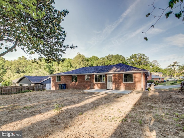 rear view of property featuring a patio area