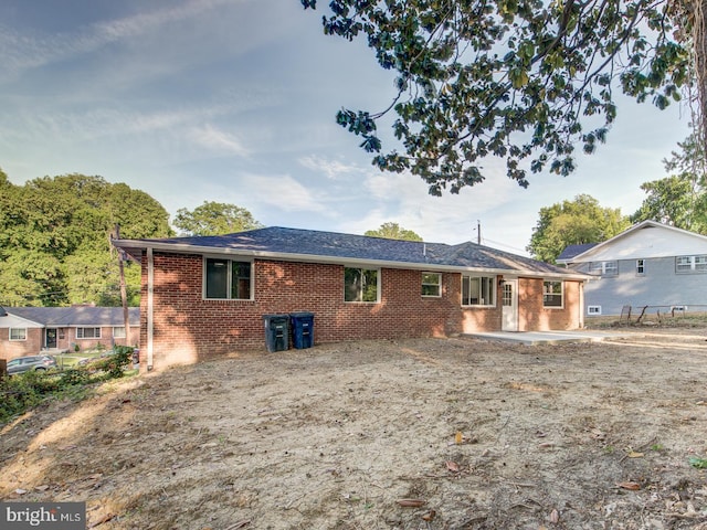 back of house with a patio area