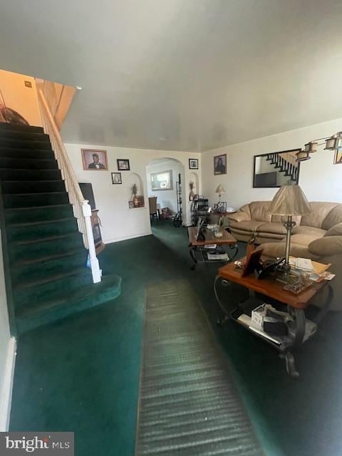 living room featuring dark colored carpet