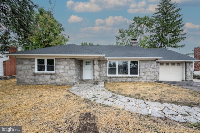 ranch-style home with a garage