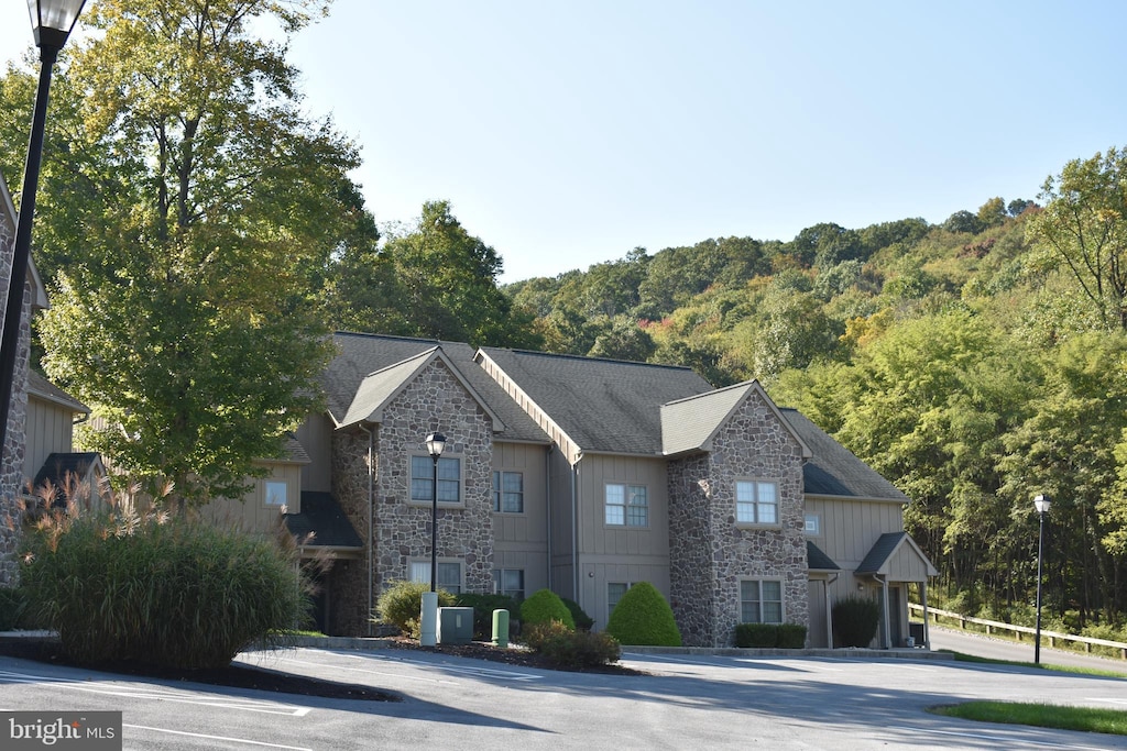 view of front of home featuring cooling unit