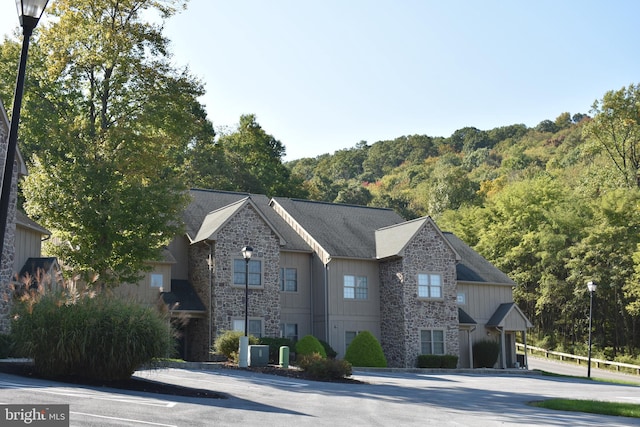 view of front of home featuring cooling unit