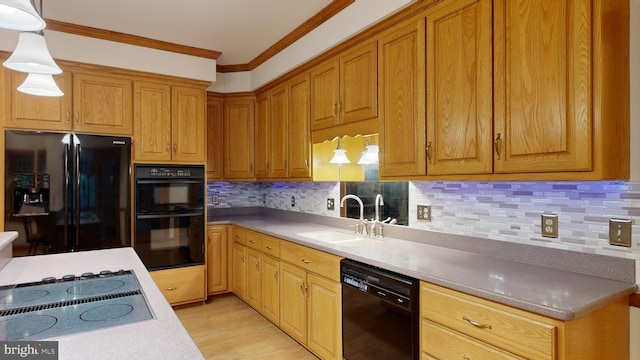 kitchen with sink, hanging light fixtures, decorative backsplash, black appliances, and ornamental molding