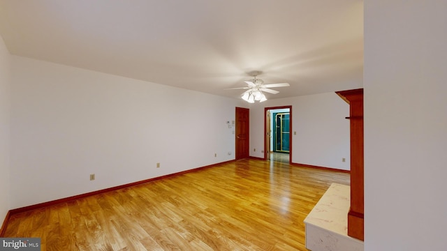 spare room with ceiling fan and hardwood / wood-style floors