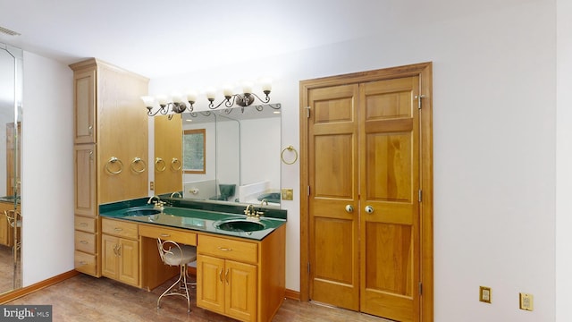 bathroom with vanity and hardwood / wood-style flooring