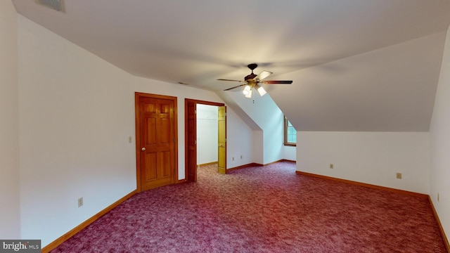 additional living space with carpet, lofted ceiling, and ceiling fan