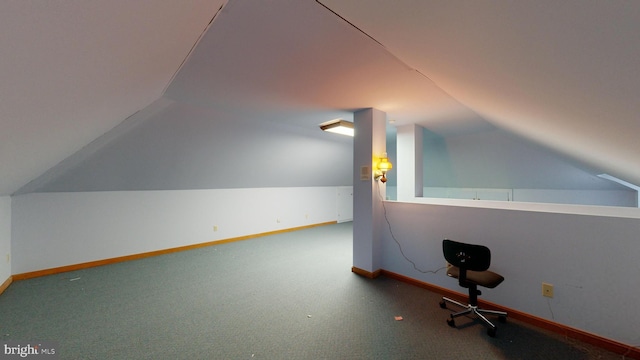 bonus room featuring vaulted ceiling and carpet flooring