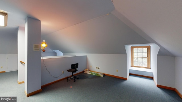 bonus room featuring lofted ceiling and carpet floors