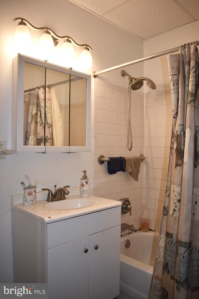 bathroom with shower / bath combination with curtain and vanity