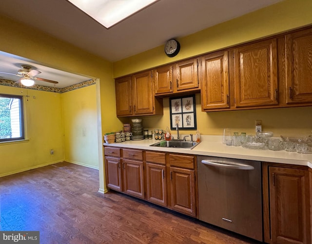 kitchen featuring stainless steel dishwasher, sink, ceiling fan, and dark hardwood / wood-style flooring