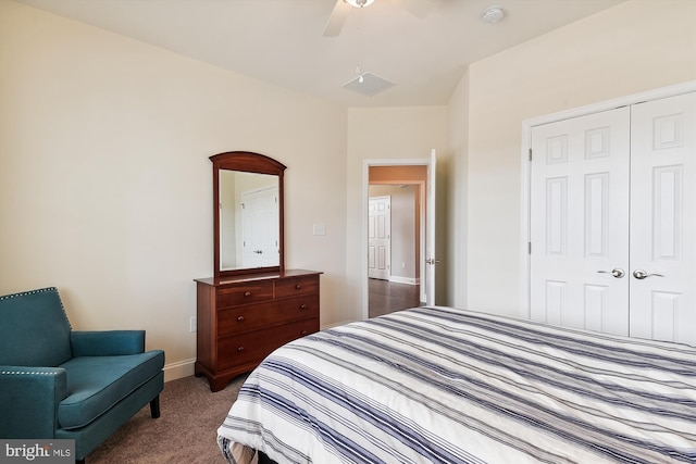 bedroom with ceiling fan, a closet, and dark colored carpet