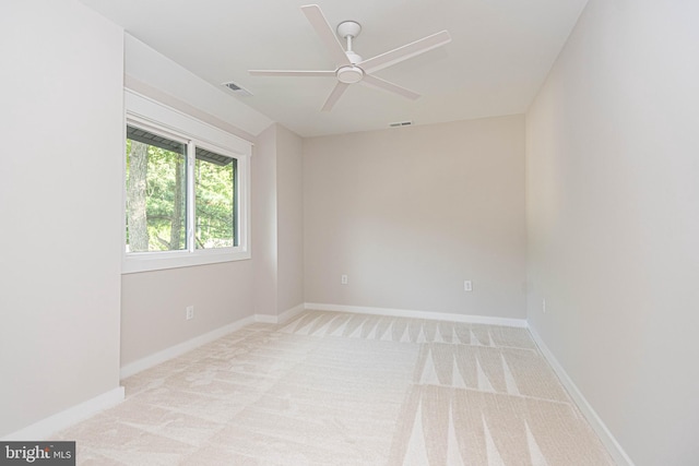 carpeted empty room with ceiling fan