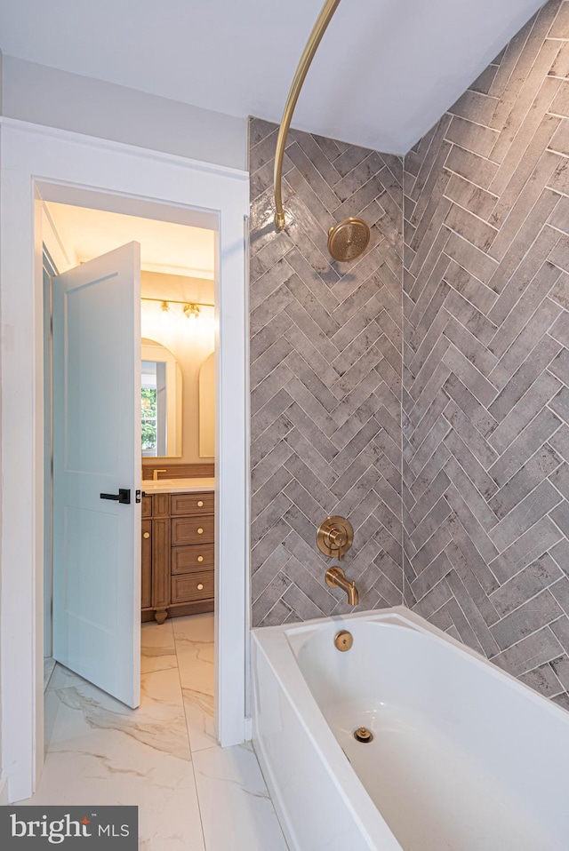 bathroom featuring vanity and tiled shower / bath combo