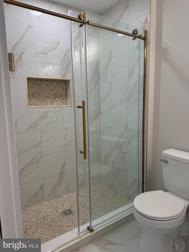 bathroom with toilet and walk in shower