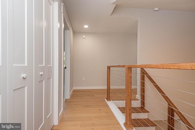 corridor with light wood-type flooring