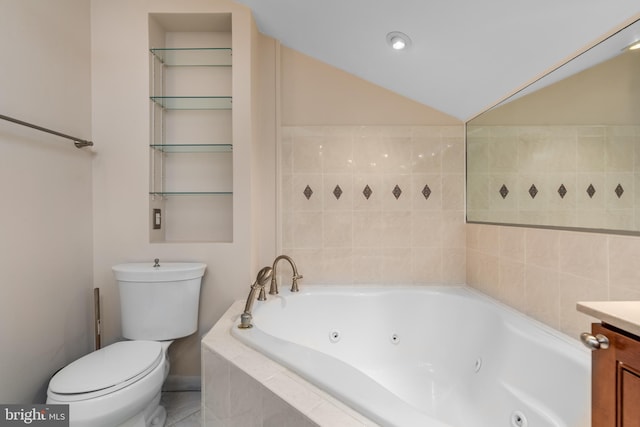 bathroom with vanity, toilet, and a relaxing tiled tub