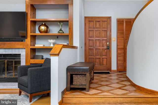 foyer featuring a fireplace