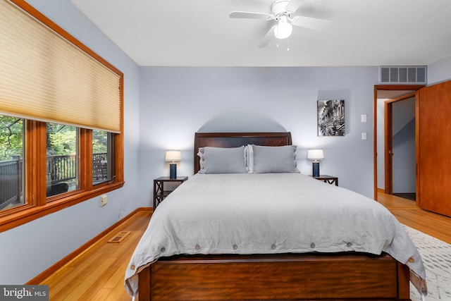 bedroom featuring light wood-type flooring and ceiling fan