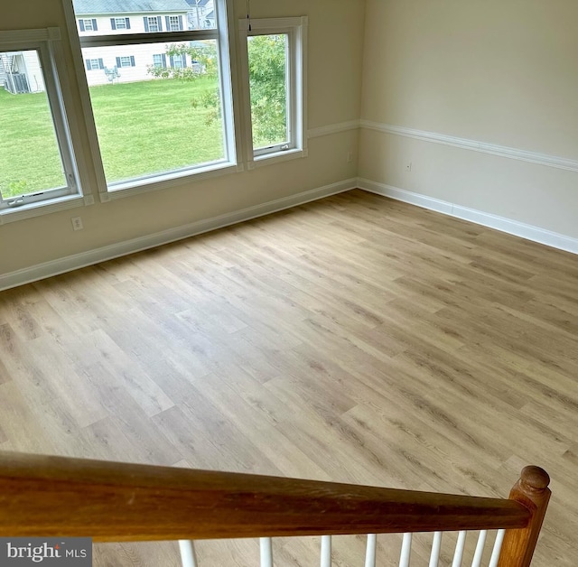 unfurnished room featuring light hardwood / wood-style floors