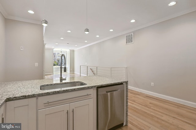 kitchen featuring light hardwood / wood-style floors, sink, stainless steel dishwasher, light stone countertops, and white cabinetry