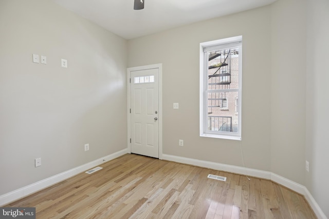 foyer with light hardwood / wood-style flooring