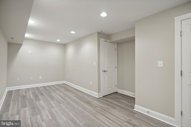 basement featuring light hardwood / wood-style floors