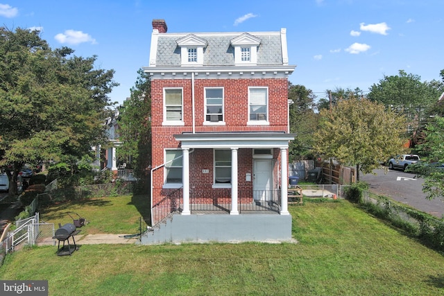 view of front of home with a front yard and a garage