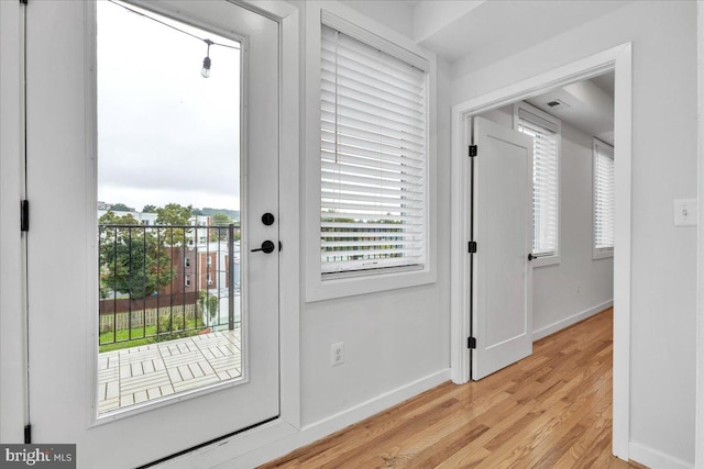 doorway to outside with light hardwood / wood-style flooring